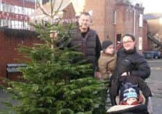Brian and Mila Sythes with sons Thomas and William, of Berkhamsted, recycle their Christmas tree at one of Dacorum Borough Council's chipping stations in 2014