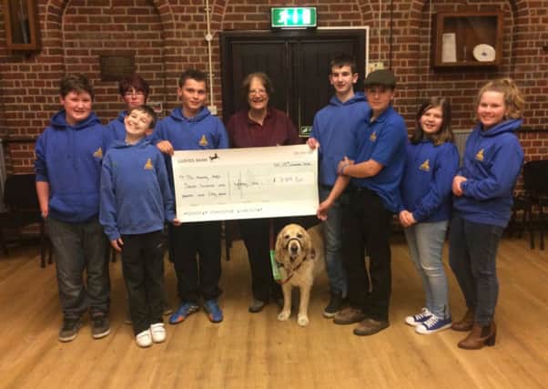 Berkhamsted Junior Young Farmers present a cheque to the Hearing Dogs charity