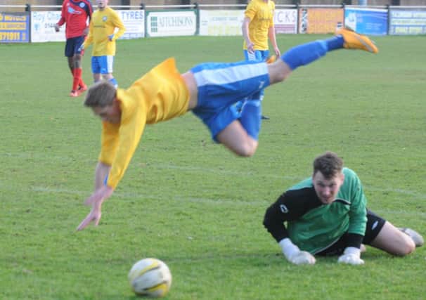 Alex Foster is denied by Biggleswade keeper Grant Beckwith