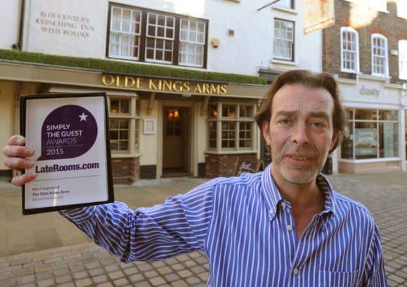 Olde Kings Arms manager Elliot Mandry with the Laterooms.com award
