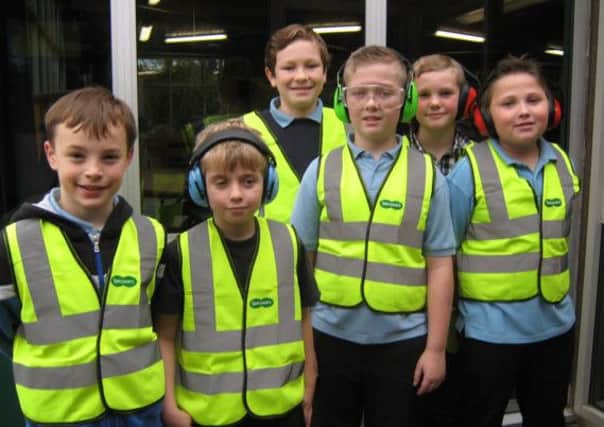 Specsavers donated more than 100 high-visibility vests to Bishop Wood School