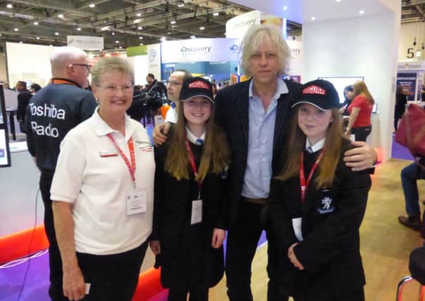 Laura Dann and Paige Seggery from Longdean School meet Sir Bob Geldof at a maths event in London's Docklands