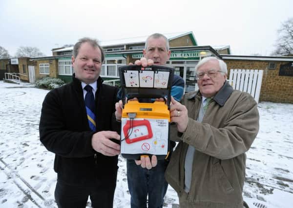 From left, Andrew Williams, centre manager Scott Boyer and Ron Tindall with the new defibrillator at Adeyfield Community Centre