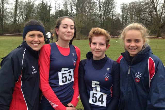 The Berkhamsted girls' team with athletics coach Amelia Ireland