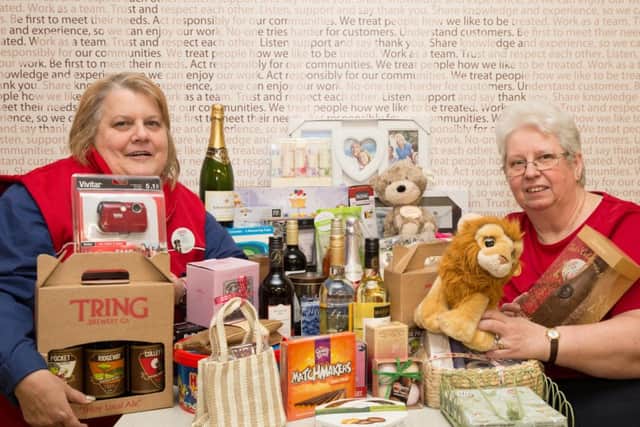 Sue Price, left, and Sue Clarke with some of the donated raffle prizes at Tesco in Tring