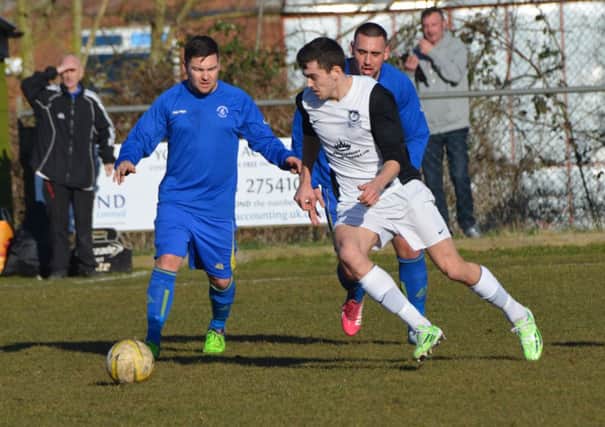 Kings Langley's Mitchell Weiss battles for the ball against Colney Heath. Picture (c) Chris Riddell