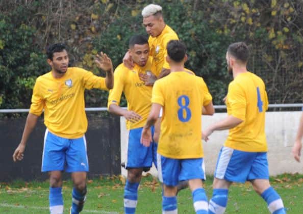 Comrades players rush to celebrate with BJ Christie
