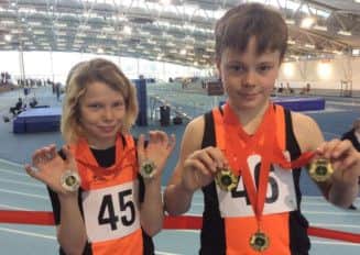 Twin brothers Ralph and Haydn Williams proudly display their county medals