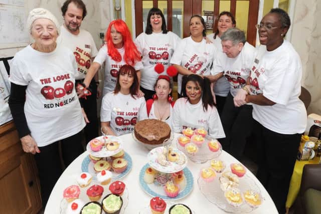 Staff and residents at The Lodge Care Home, Hemel Hempstead,with the special arangement of Red Nose Day cakes
