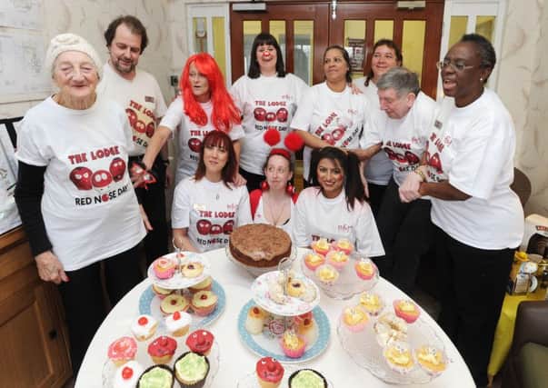 Staff and residents at The Lodge Care Home, Hemel Hempstead,with the special arangement of Red Nose Day cakes