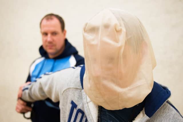 Spit guards are being rolled out by Herts Police
