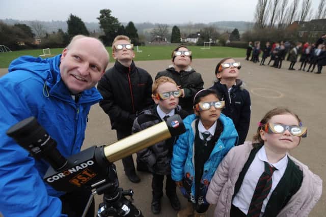 Head teacher at Pixies Hill School, Hemel Hempstead, Martin Smith, and pupils preparing to view the partial eclipse