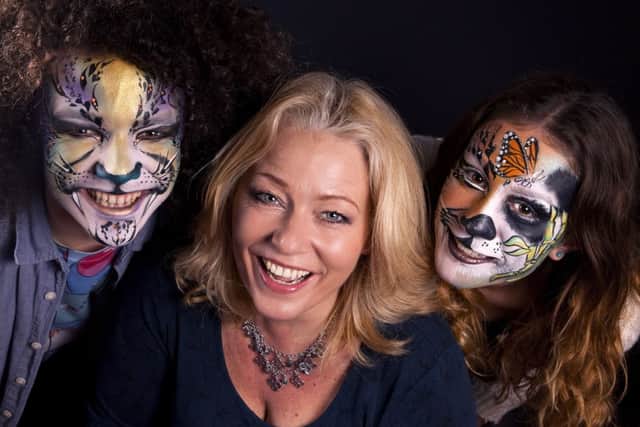 Zoe with models that she has face painted.Picture by Simon Husband Photography.