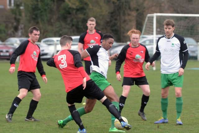 Leverstock Green's Nathan Jallow battles for possession