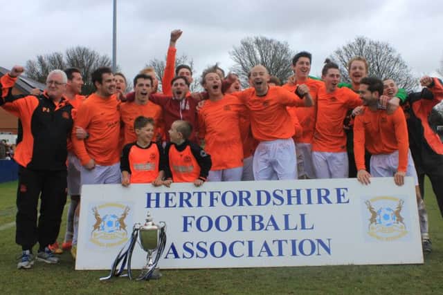 Echoes FC celebrate their victory at The County Ground