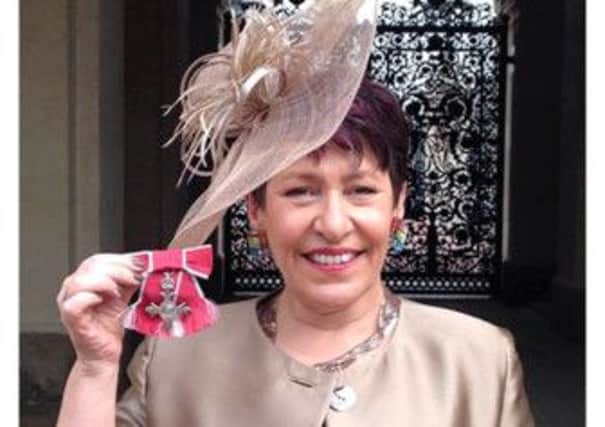 Dr Ros Taylor receives her MBE for Services to Hospice Care last year PNL-150331-151858001