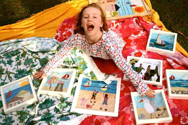 Annelies Struthers, eight, with her art work which is in hot demand
