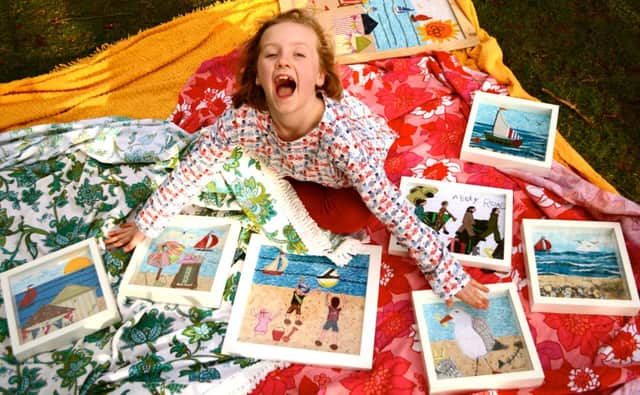 Annelies Struthers, eight, with her art work which is in hot demand