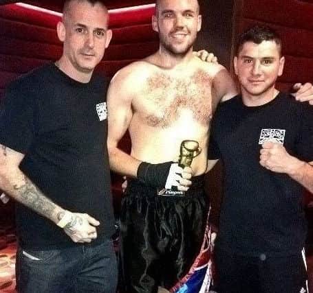 Britannia Gym, from left head coach Nick Morrish, fighter Tom Godfrey and coach Shane Bernhauser.