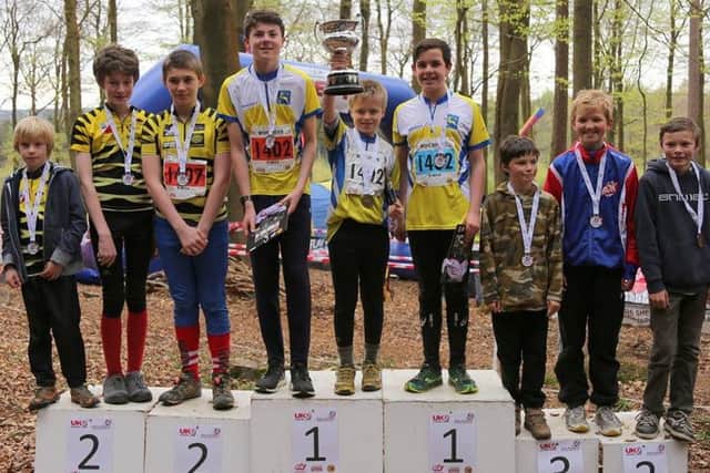 Angus Harrington, Alex Fielding (holding the trophy) and Josh MCaw won gold for Happy Herts Orienteering Club . Photo (c) Rod Harrington