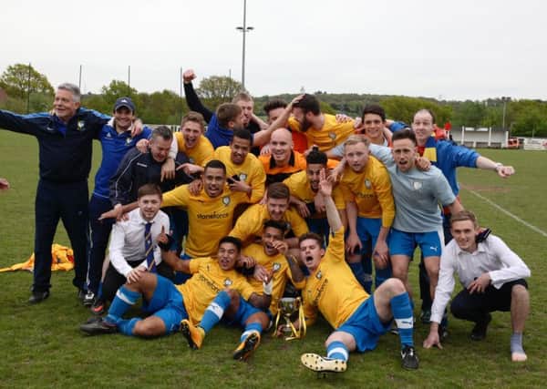 The Berkhamsted players and management team celebrate their cup win. Picture (c) Jackie Davis