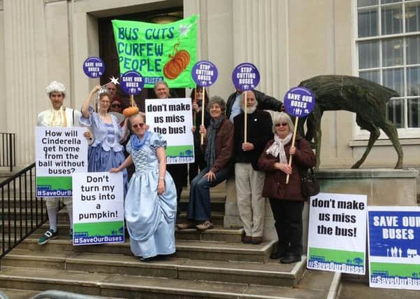 Bus cuts protest outside County Hall.