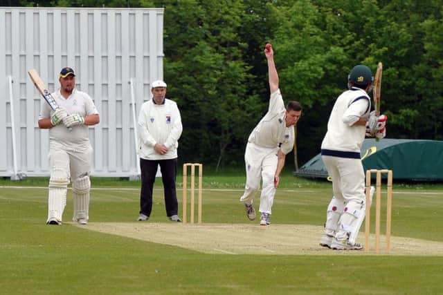 Kings Langley bowler Andrew Burnell in action against Dunstable