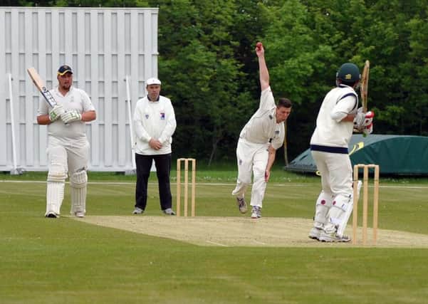 Kings Langley bowler Andrew Burnell in action against Dunstable