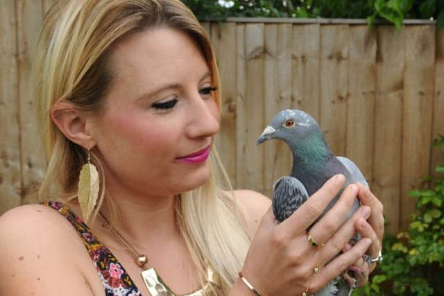 Sarah Poynter and saved pigeon 'Riley' at home in Hemel Hempstead