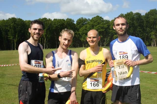 The first four men in (Adam Hill, far right, and Ian Hammett in yellow) at the Ashridge Trail Half Marathon, June 2015