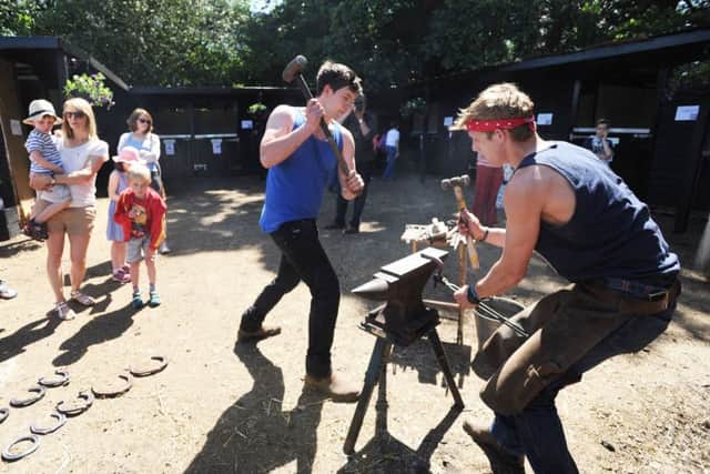 Fun day at Two Oaks Pony Sanctuary, Northchurch. Blacksmith James Elliott, right, and his apprentice Stephen Harte
