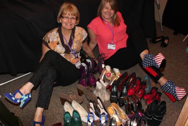 Rennie Grove district retail managers Michelle Remice and Lisa Collinson with their grooviest shoes