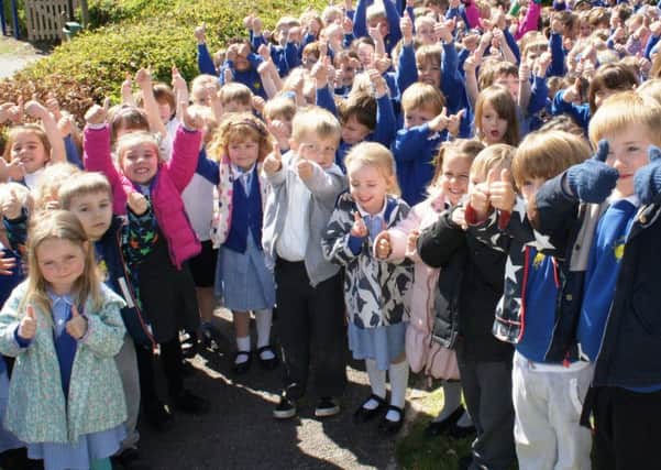 Goldfield pupils giving their school the thumbs up