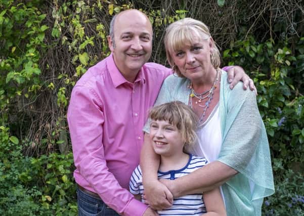 David and Lucy Leveson with daughter Katy, 10. 
Picture by Steve Blogg.
