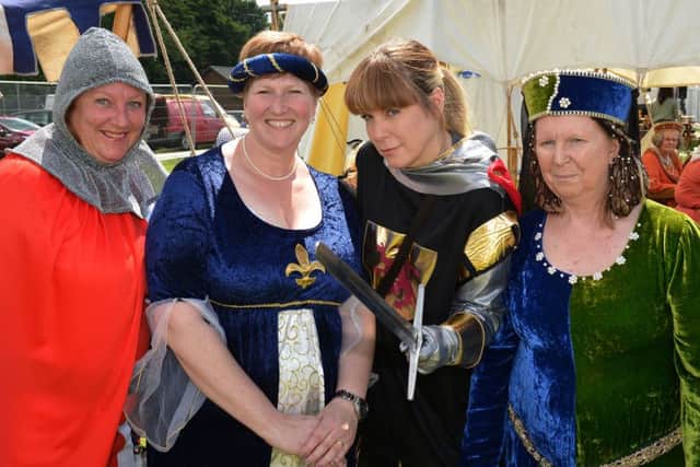 Tring Carnival and parade through the town. Pound Meadow.  Members of The Medieaval Combat Society. PNL-150627-183800009