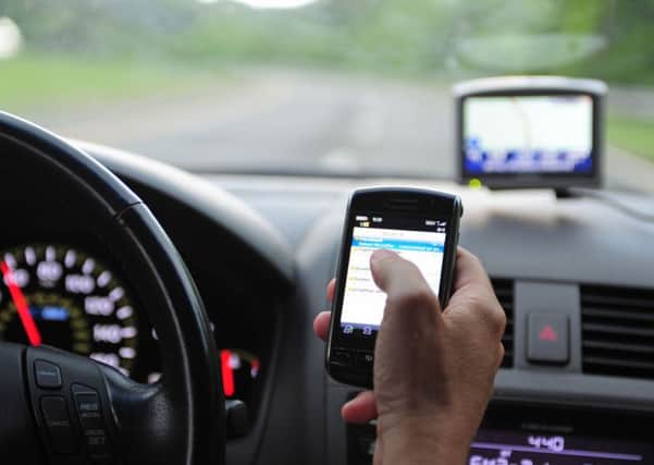 Police will be clamping down on motorists who use their mobile while behind the wheel.