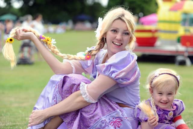 Family fun day for Keech Children's Hospice at Ashlyns School. The event is organised annually by Danny and Sam Kerr in memory of their daugher Lexi. Lexi's sister Caitlyne pictured with Rapunzel.