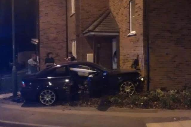 The aftermath of the crash which left the BMW embedded into the front of the house in New Mill, Tring