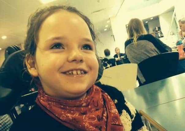 Sienna Hollick, eight, suffers with a severe form of epilepsy and needs a specially-adapted wheelchair to stop the curvature of the spine