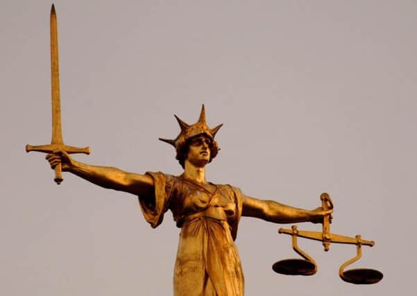 The Scales of Justice on top of the Old Bailey in central London, as the jury in the Soham murder case enters the third night of deliberation. Lord Justice Moses has sent the jury to reach verdict in the case agianst Ian Huntley and Maxine Carr, who face charges relating to the unlawful deaths of school girls Holly Wells and Jessica Chapman.