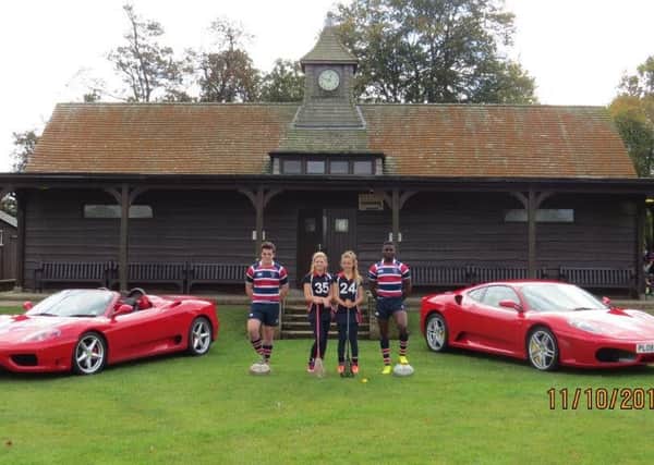 Students and Ferraris by the pavilion at Berkhamsted School