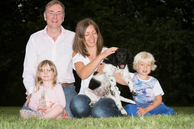 The Manners family with their Stabyhoun dog Helmer , one of only 34 in the country - pictured are Lene and Andrew with their children Freya (3) and Max (5)