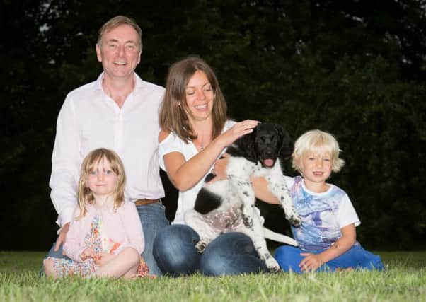 The Manners family with their Stabyhoun dog Helmer , one of only 34 in the country - pictured are Lene and Andrew with their children Freya (3) and Max (5)