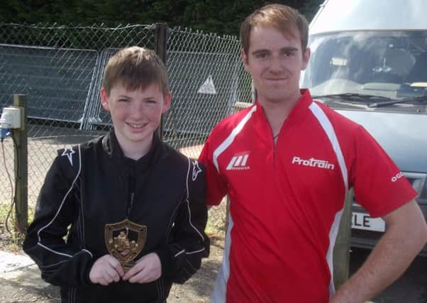Luke Richardson with his mechanic Charlie after receiving his Best Rookie trophy