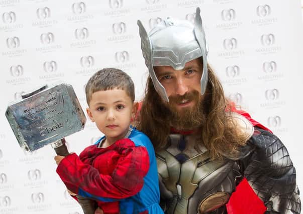 Thor with a young fan at the Superhero Fun Day event at the Marlowes Shopping Centre. Photo: Simon Pamment Photography