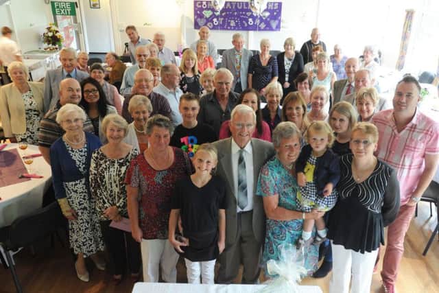 Dot and John Burgin, centre front, celebrated their golden wedding anniversary at Flaunden Village Hall