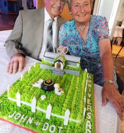 Keen bowls players Dot and John Burgin celebrated their golden wedding anniversary with a bowling green cake