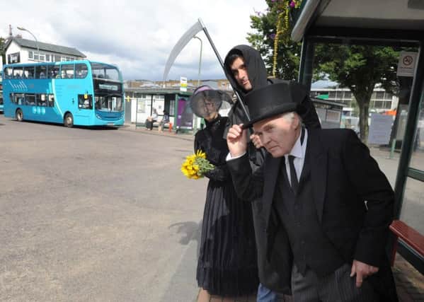 A wake for buses in Hemel Hempstead. Terry Figg, with top hat,  Martin Abrams and Susan Dye