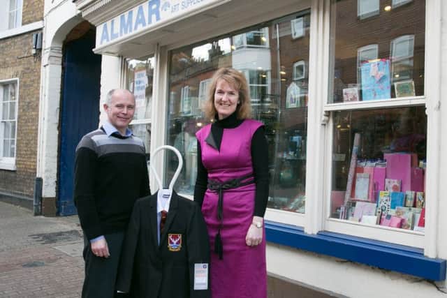 Almar in Tring sells Tring School clothing: Chris Sanders from Almar and Sue Collings, Tring School headteacher.