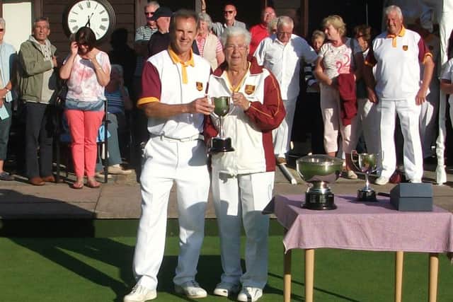 Kevin Clarke receives his third trophy at Berkhamsteds Finals Weekend having won the Mens Singles, Mens Pairs and Open Handicap Singles competitions